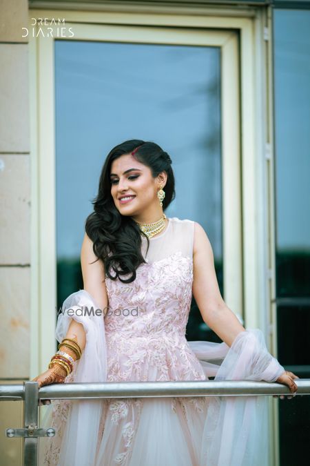 Photo of Bride in pastel pink engagement gown