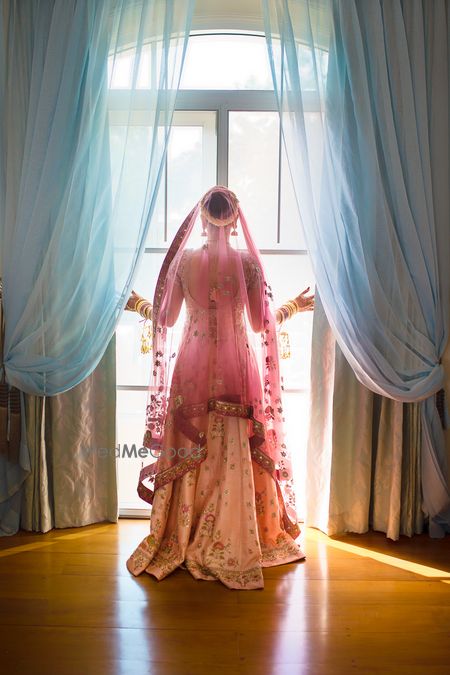 Bride looks out of a window