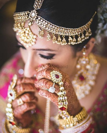 Photo of Bride with haathphool wearing jewellery