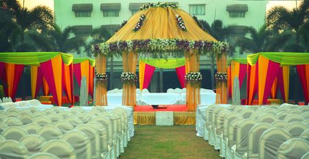 Yellow Mandap with Red and Yellow Tents