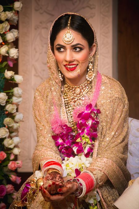 Champagne Pink Bride wearing Gold Bridal Jewelry