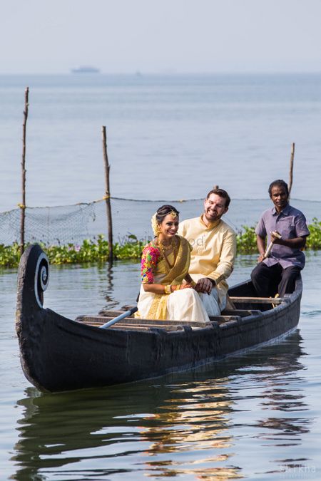 Photo of Kerala wedding idea couple entering in boat