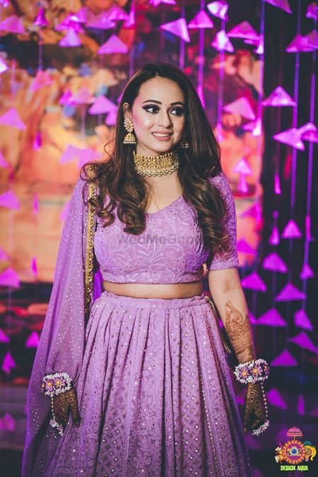 Lilac lehenga for mehendi with matching floral jewellery 
