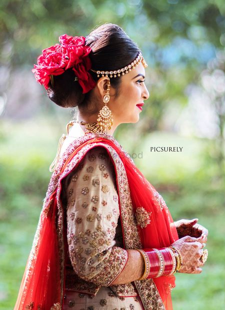 A bride with red flowers in her hair