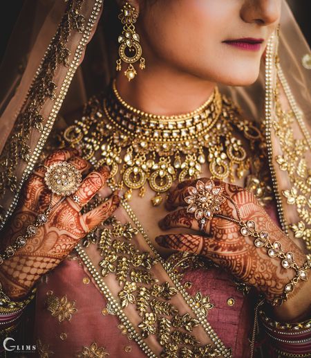 Statement bridal jewellery with necklace and haathphool 