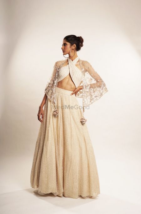 Unique blouse design for sangeet lehenga in off while 