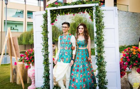 Matching bride and groom wearing same fabric on mehendi 