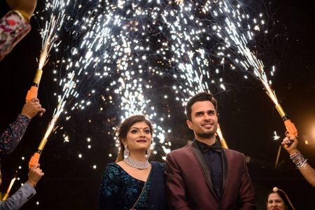 Guests holding cold pyros for bride and groom entry