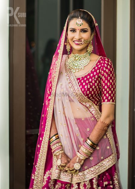 Photo of Bride in maroon with double dupatta