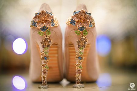 Bridal shoes with engagement rings on heel