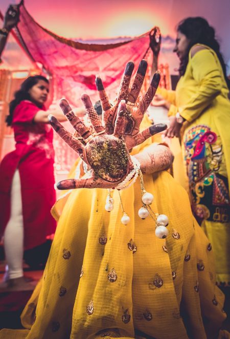 Photo of Bride showing off mehendi not face