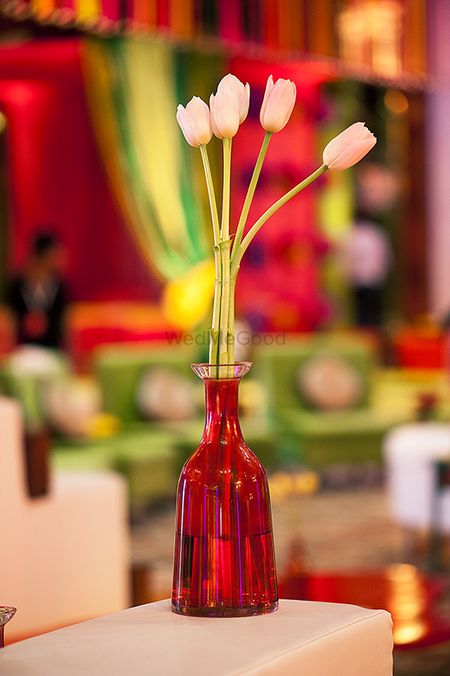 Photo of tulips inside glass bottles