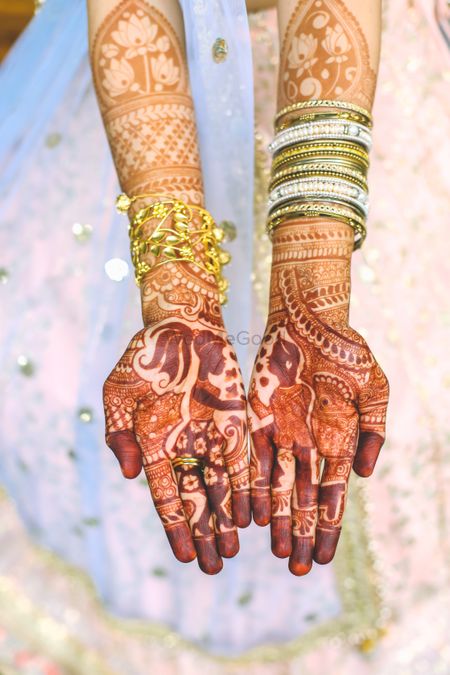 Photo of Bridal hands with proposal mehendi design