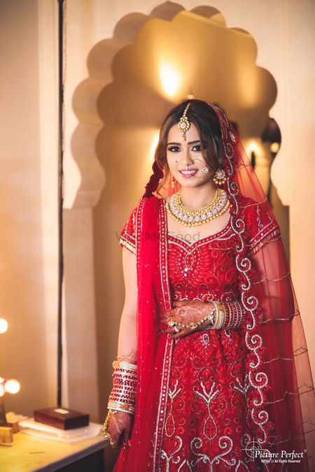 Bride in red with different hairdo 