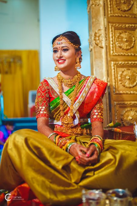A south Indian bride poses in a kanjeevaram and temple jewellery