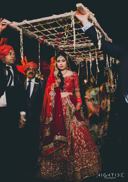 Red sequin bridal lehenga entry photo 