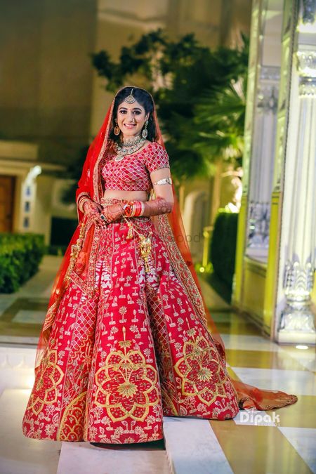 Red modern bridal lehenga with floral motifs
