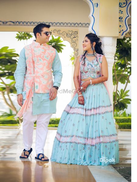 Photo of Mehendi bride and groom look in light blue