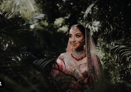 Outdoor bridal portrait with bride in pink 