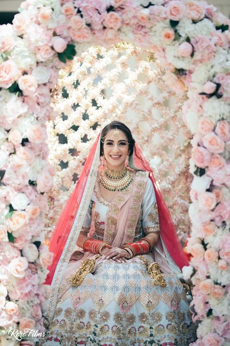 Photo of Bride in floral Palki shot