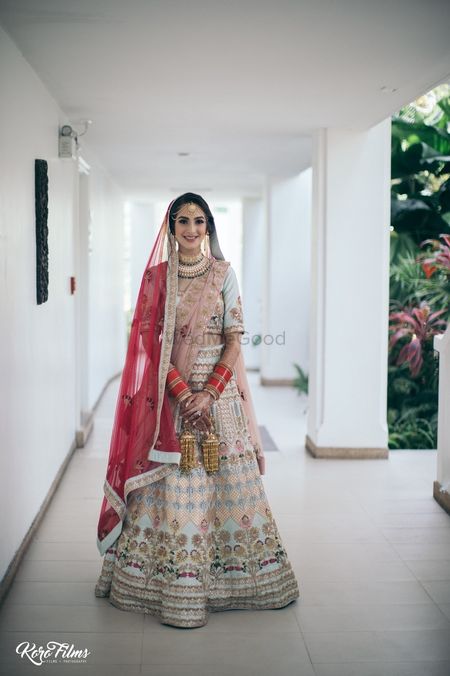 Photo of Offbeat bridal lehenga in red and light blue