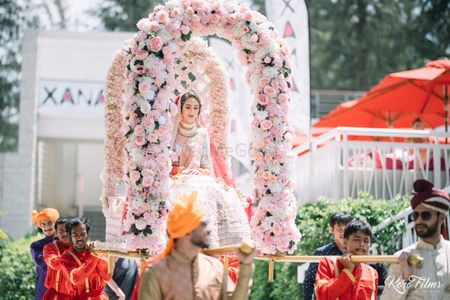 Bride in floral Palki entry shot 