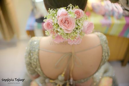 Babys breath and roses in bridal bun in pink