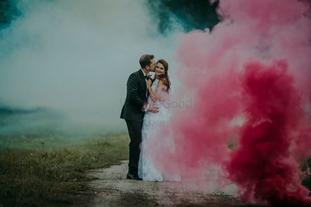 Couple portrait with smoke sticks post wedding