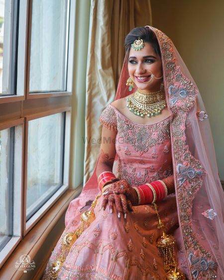 Photo of Pastel bridal lehenga with floral embroidery