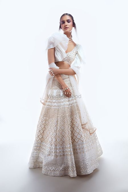 Sister of the bride lehenga in white with frill sleeves 