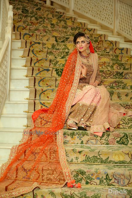 orange dupatta with soft pink lehenga