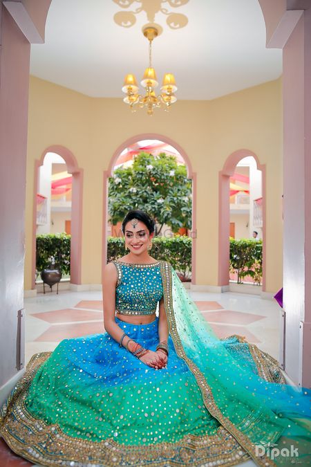 Photo of Blue and turquoise ombre lehenga with mirror work