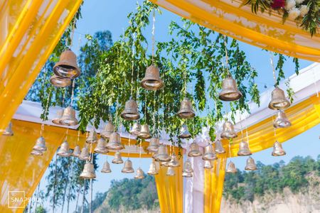 Mandap decor idea with hanging bells 