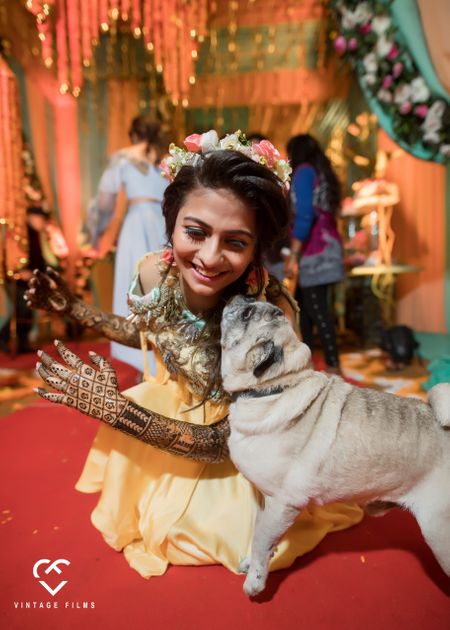 Cute mehendi bride with dog photo