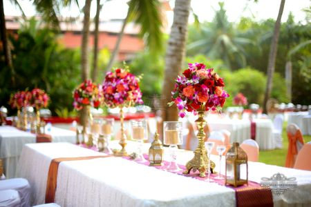 Tall table centerpieces in red and purple
