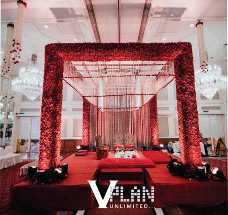 Photo of mandap with red roses on it