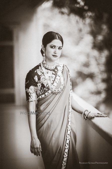 Bride in saree and layered jewellery with bun