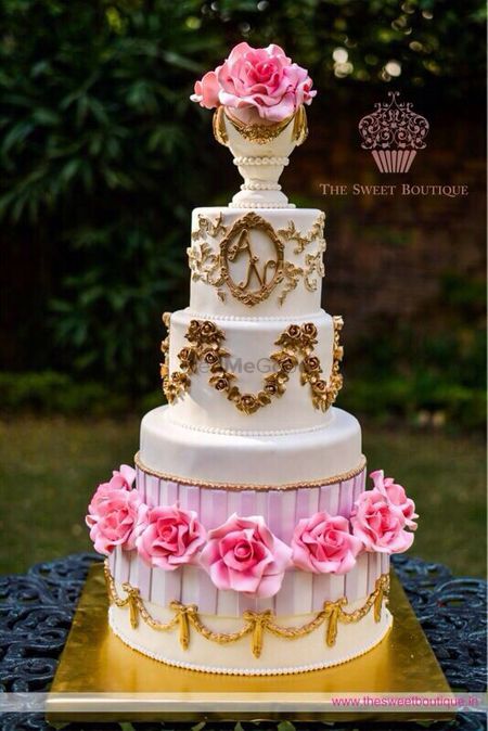 multi story white and gold wedding cake