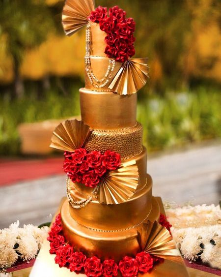 Glamorous gold and red wedding cake