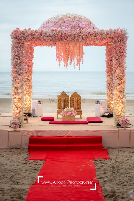 Photo of A  minimal, floral mandap against the sea