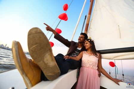 Photo of pre wedding shoot on  a sailboat