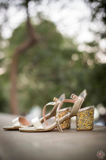 Photo of Gold shimmery block heels for bride