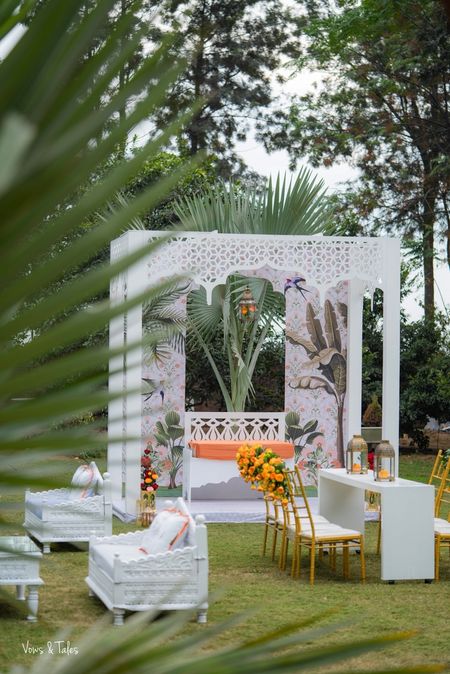 Photo of Mehendi or wedding decor with all white mandap