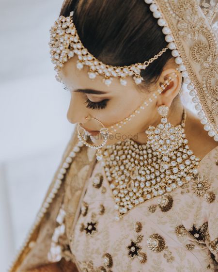 Bridal jewellery with beige lehenga and bib necklace