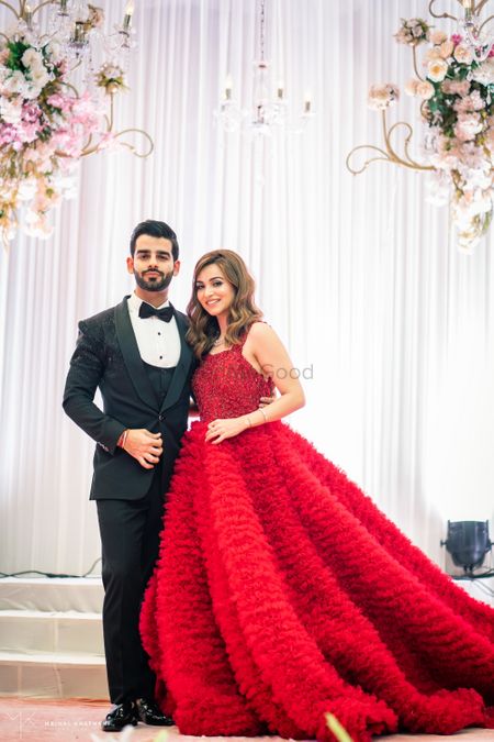 Feather floor length red gown for reception