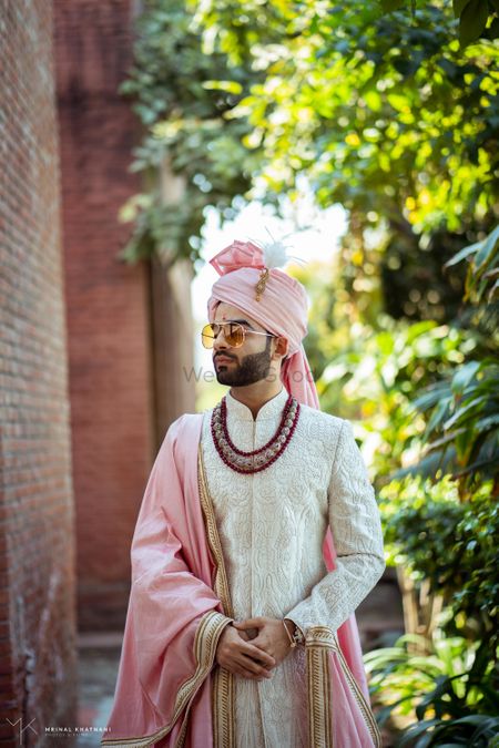 Photo of Groom in ivory sherwani with matching safa and stole