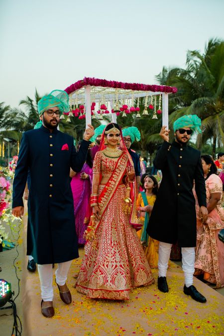Bridal entry with matching bridesmen in green safas
