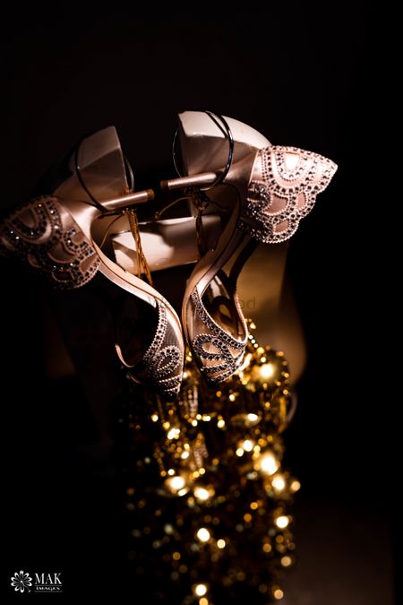 Photo of Embellished bridal shoes with interesting photography