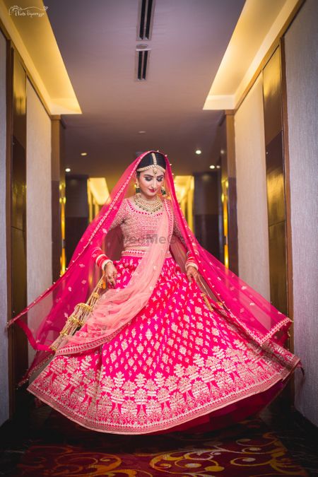 Bright showing off her bright pink gota patti lehenga 