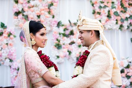 Couple portrait for morning wedding in contrasting bride and groom outfits 